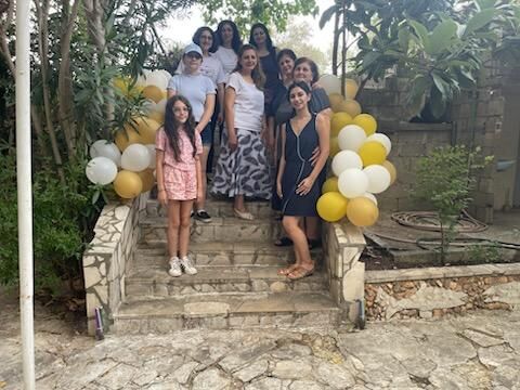 Fadia Makdisi standing with women in her family